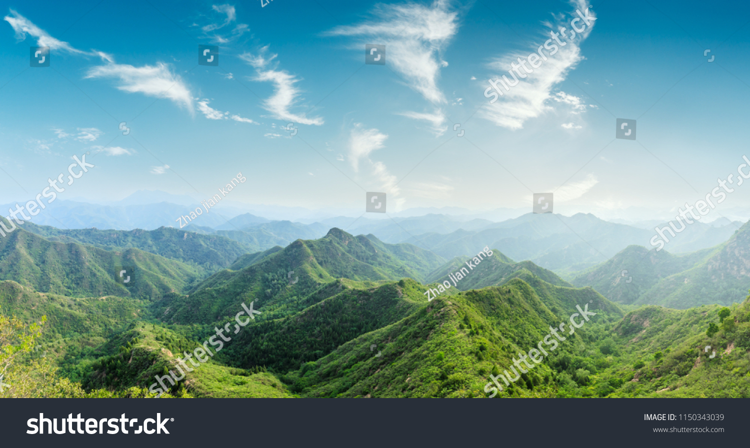 Green mountains and beautiful sky clouds under the blue sky #1150343039