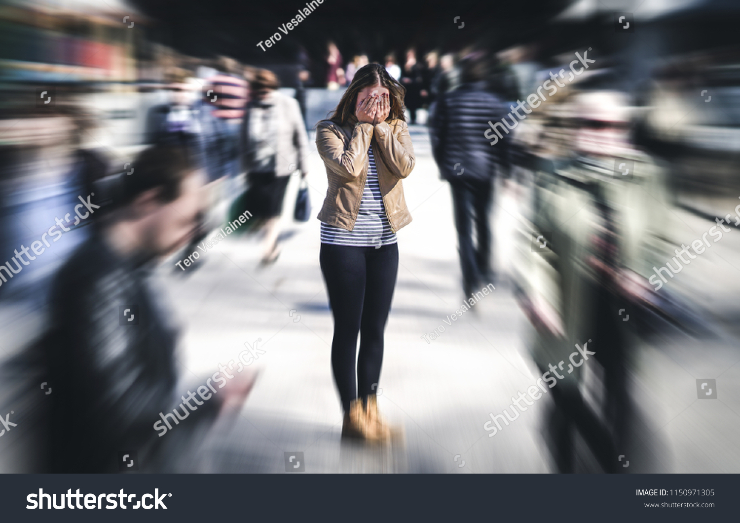 Panic attack in public place. Woman having panic disorder in city. Psychology, solitude, fear or mental health problems concept. Depressed sad person surrounded by people walking in busy street. #1150971305