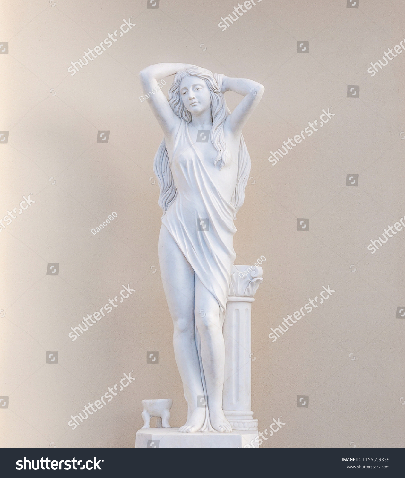 Garden sculpture depicts the figure of a beautiful young woman (not the author's work) #1156559839
