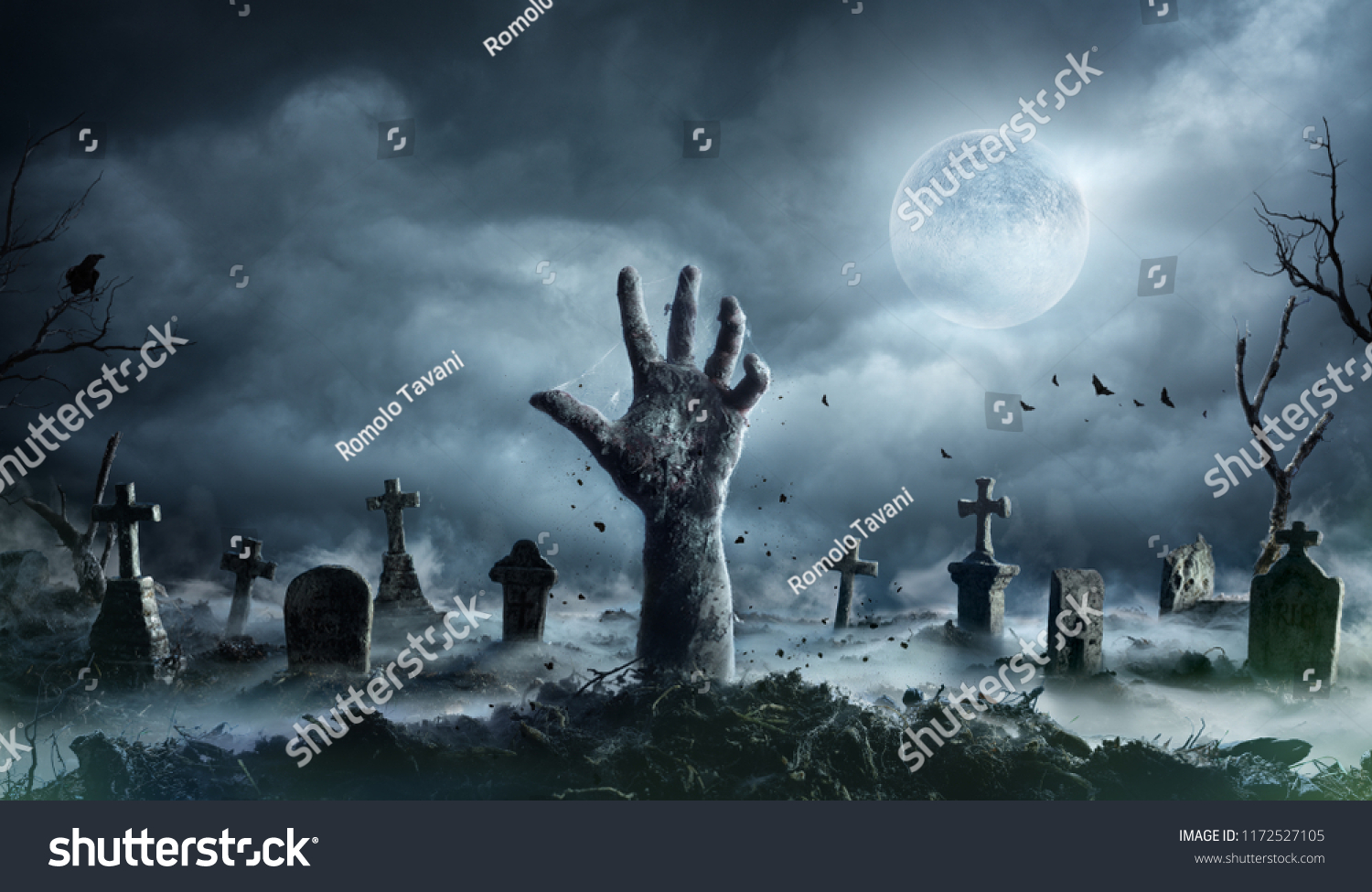 Zombie Hand Rising Out Of A Graveyard In Spooky Night
 #1172527105