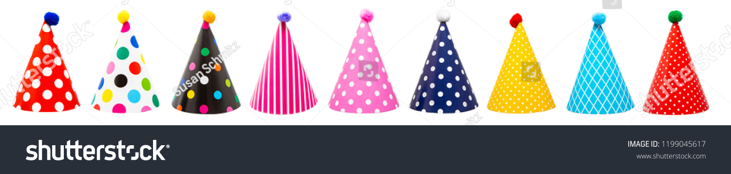 Row of nine colorful festive birthday party hats with different patterns and pom-poms #1199045617