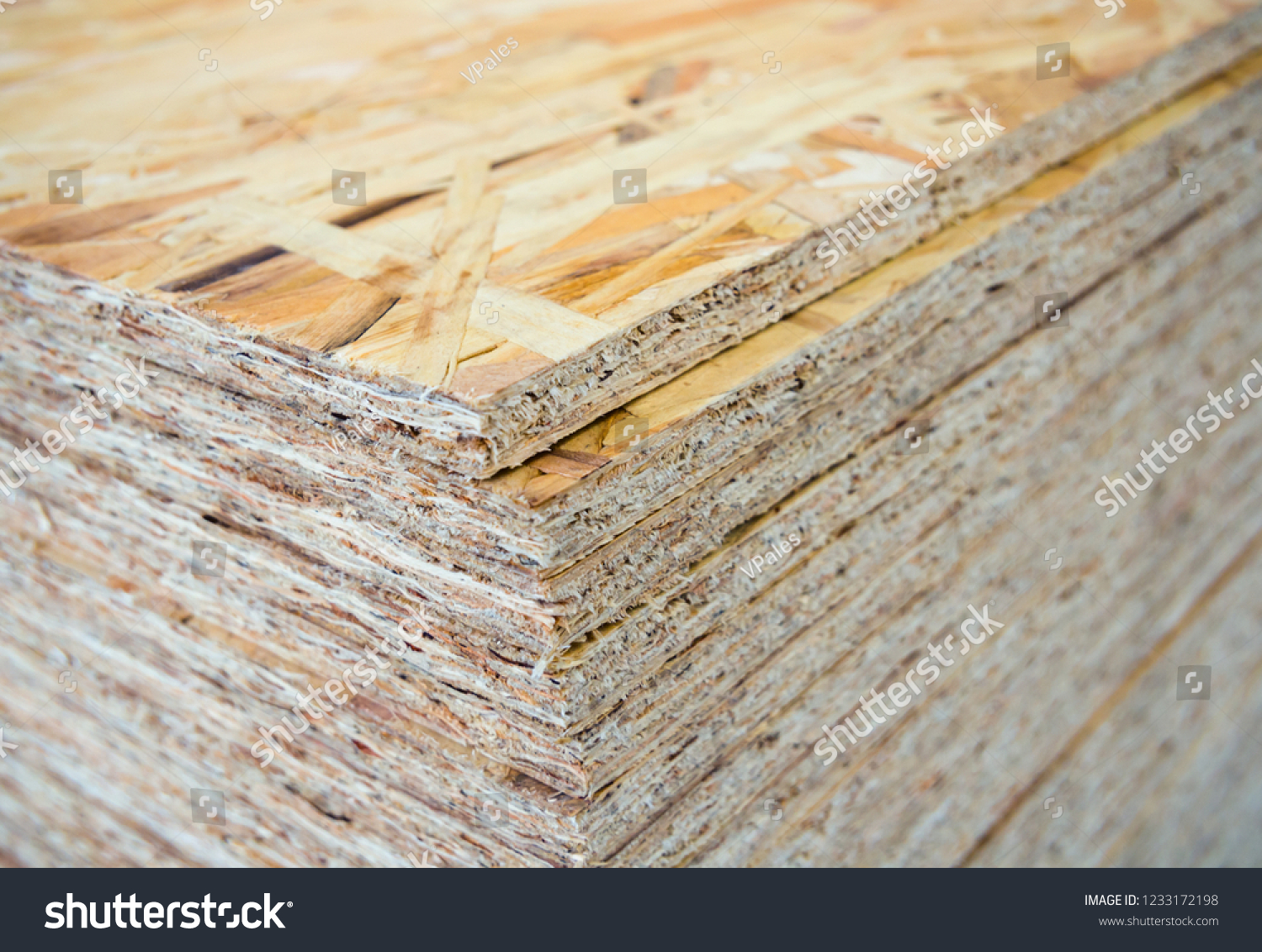 A stack of OSB sheets stacked one on another #1233172198