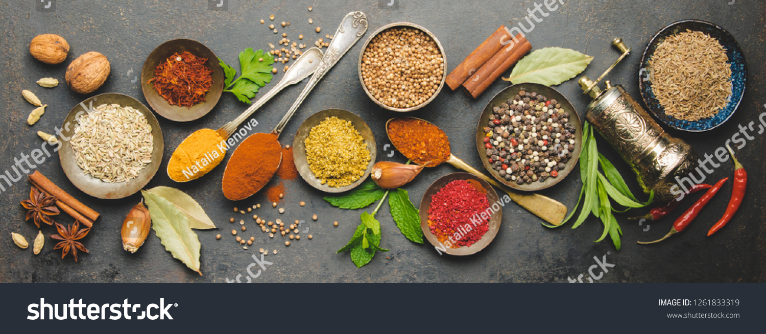 Herbs and spices on dark background, flat lay #1261833319