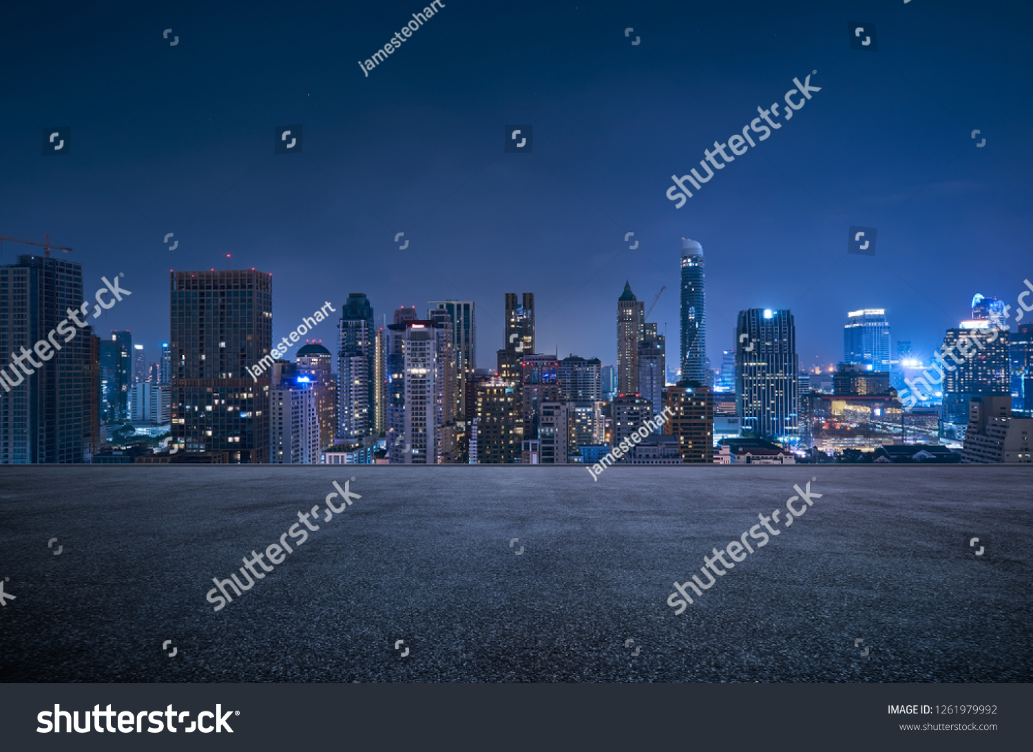 Bangkok urban cityscape skyline night scene with empty asphalt floor on front #1261979992