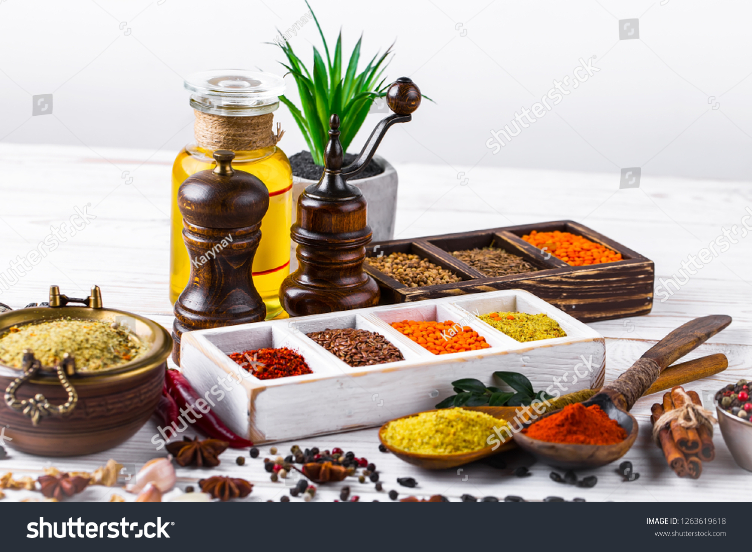 Spices and seasonings on the kitchen table on the old background #1263619618