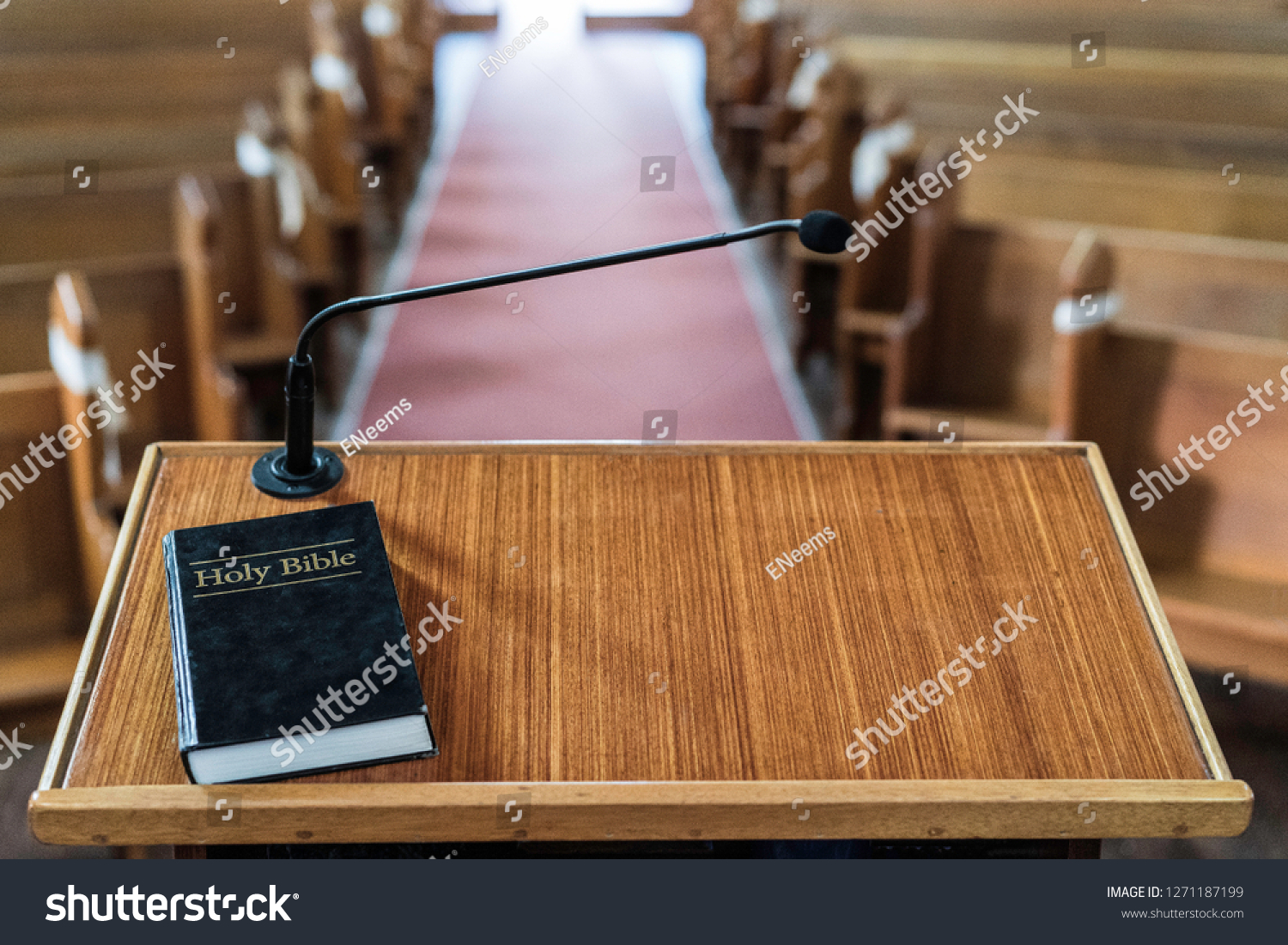 view of church pulpit with bible on it, overlooking the church #1271187199