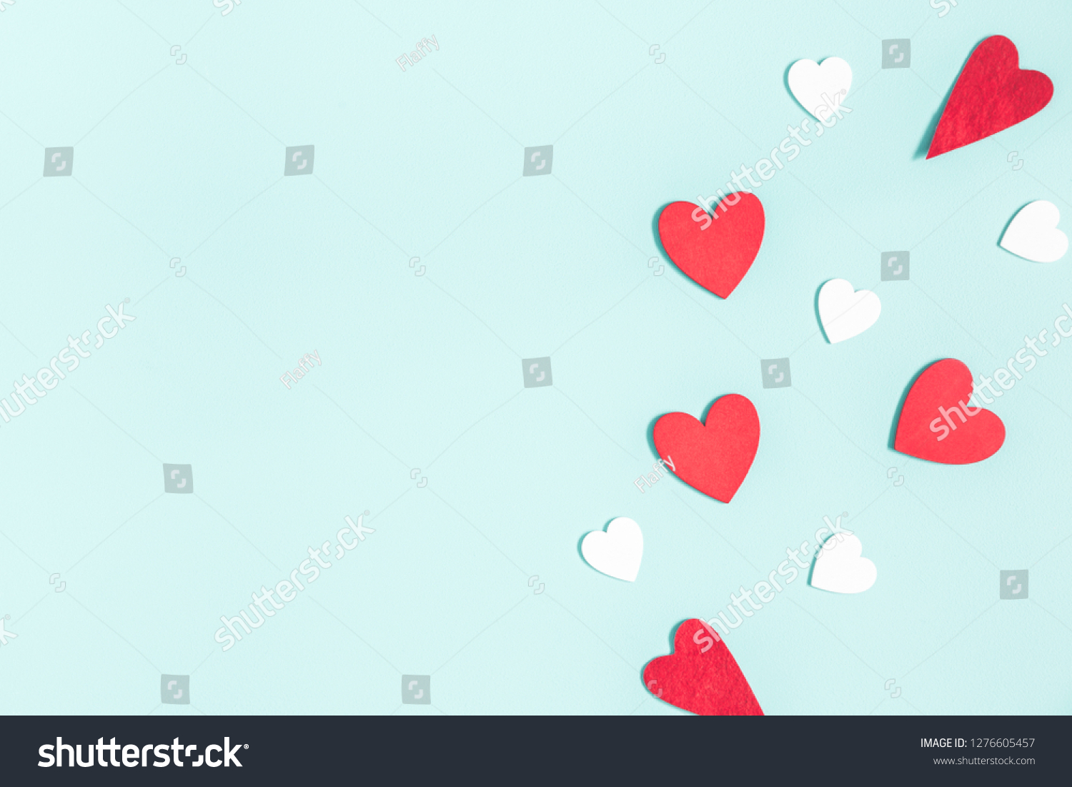 Valentine's Day background. White and red hearts on pastel blue background. Valentines day concept. Flat lay, top view, copy space #1276605457