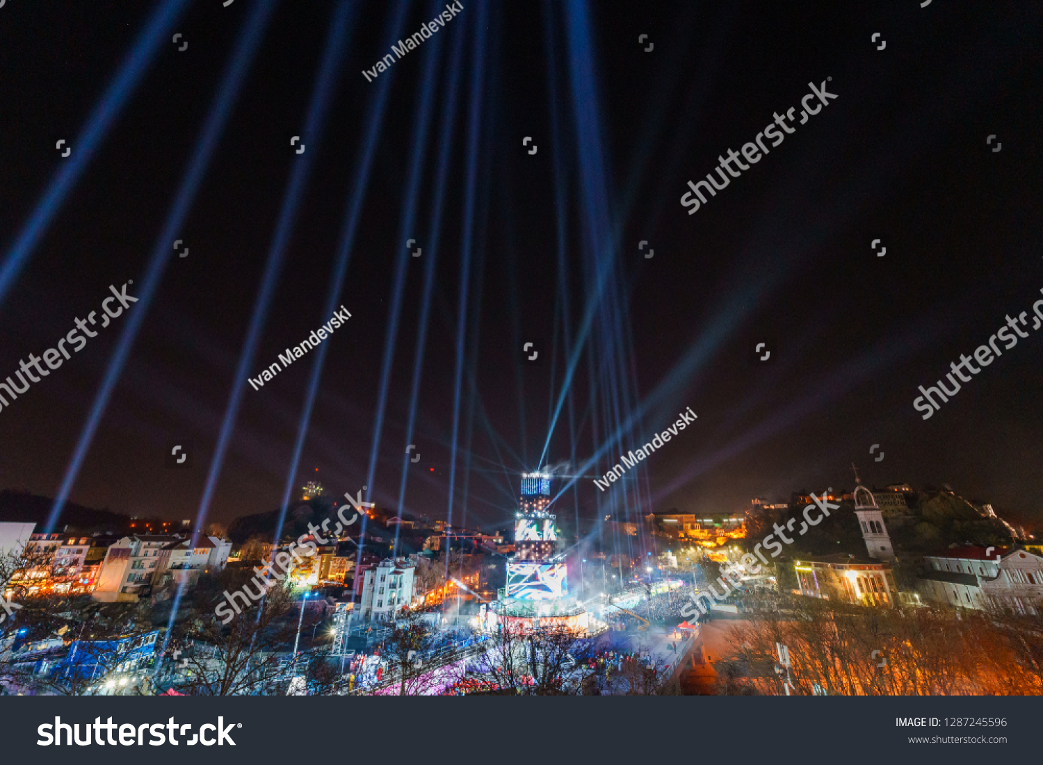 PLOVDIV, BULGARIA - JANUARY 12, 2019 - Main tower stage and fireworks for the opening event of European Capital of Culture - Plovdiv 2019. Light show at night. #1287245596