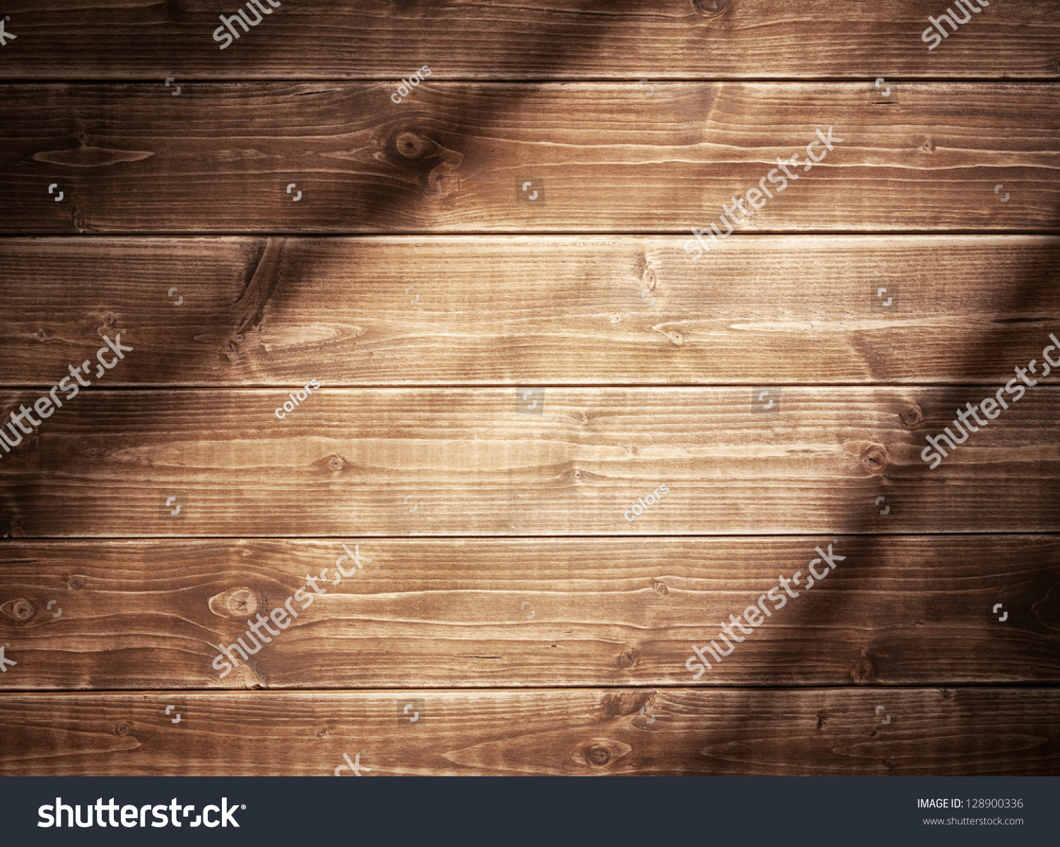 Wooden wall background in a evening light. With shadows from a window frame. #128900336