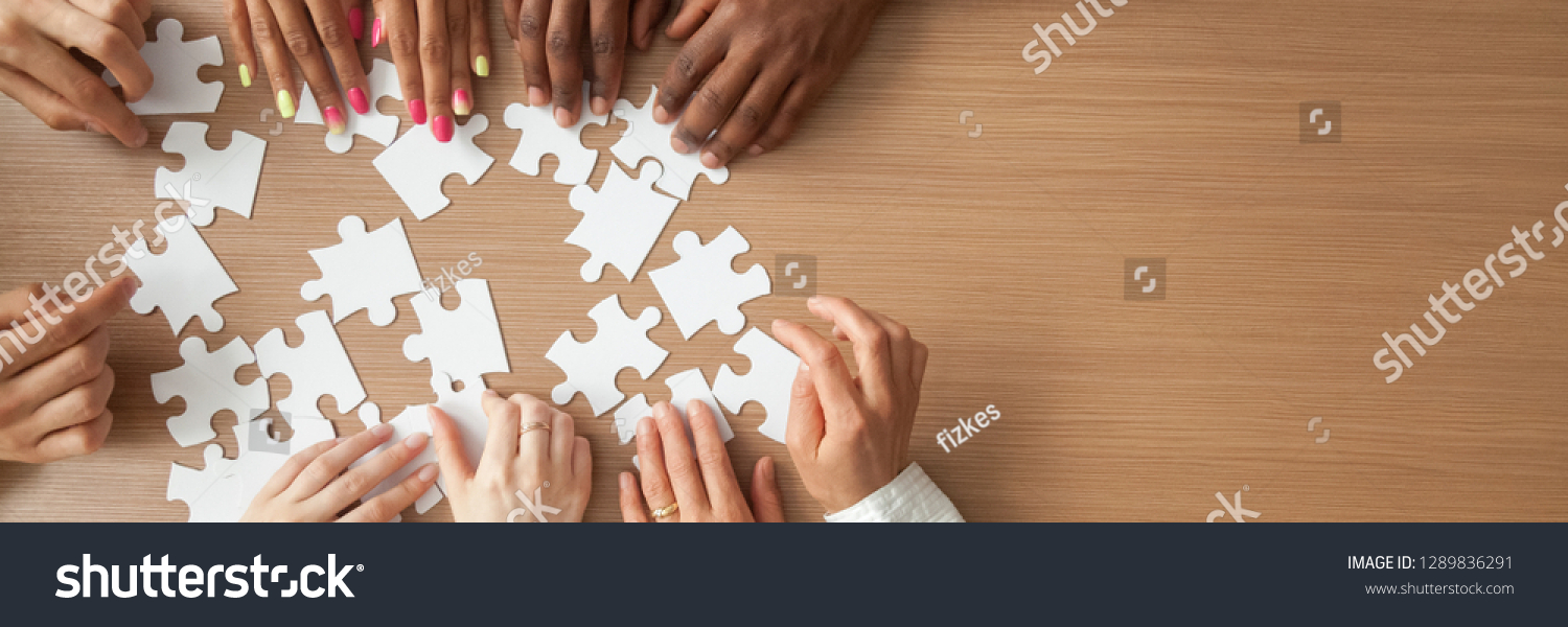 Above top panorama copyspace for text diverse hands people assemble jigsaw puzzle put pieces together search common decision. Support teamwork concept horizontal photo banner for website header design #1289836291