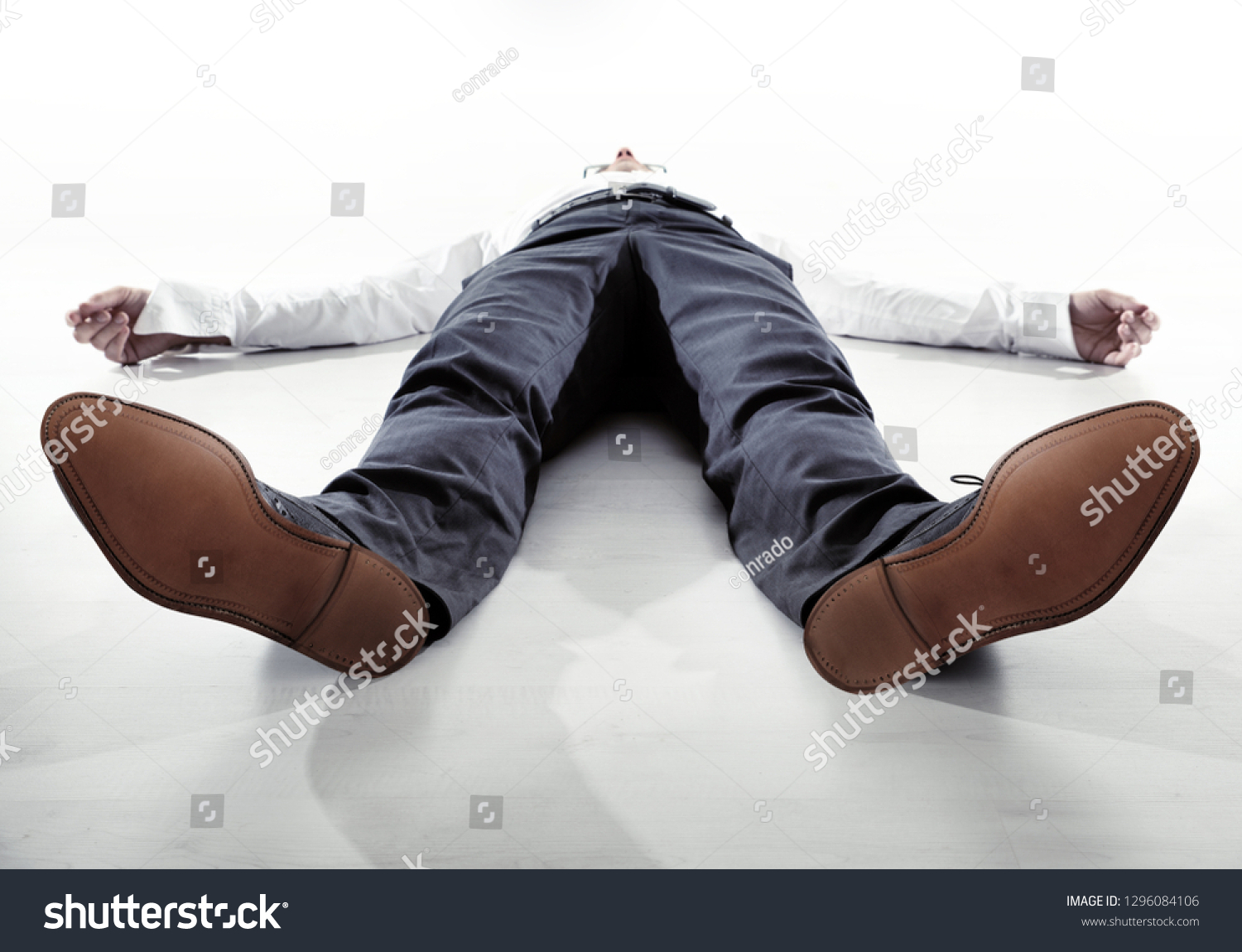 Businessman or office worker lying fainted on the floor #1296084106