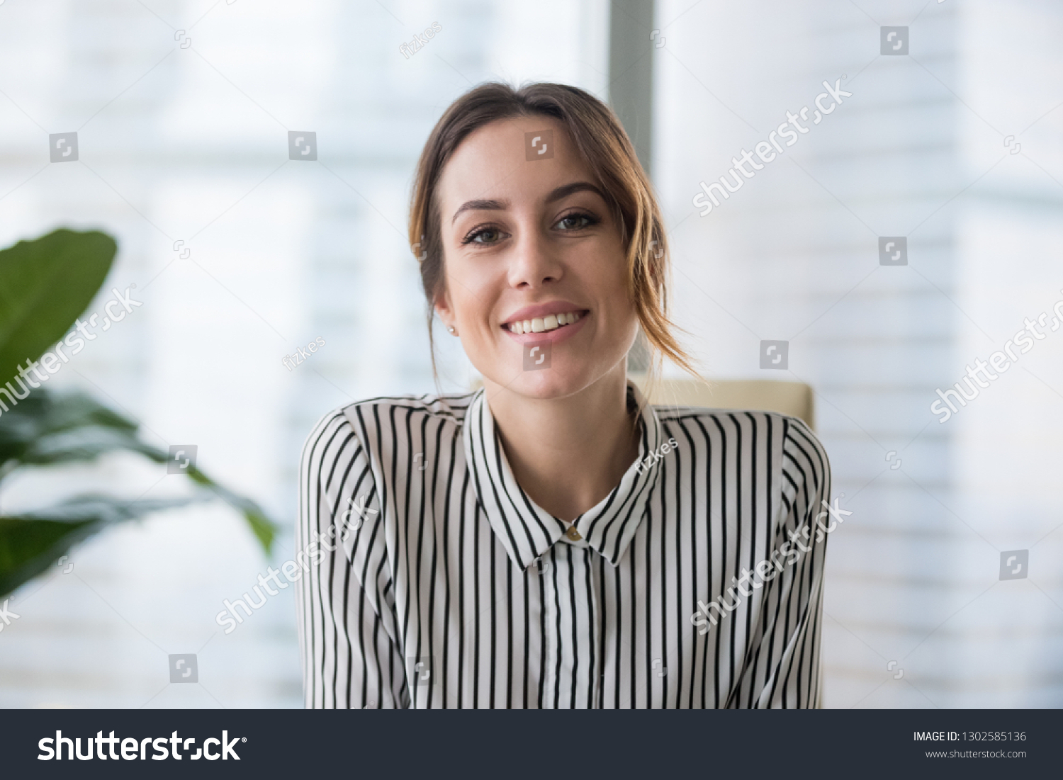 Smiling businesswoman looking at camera webcam make conference business call, recording video blog, talking with client, distance job interview, e-coaching, online training concept, headshot portrait #1302585136