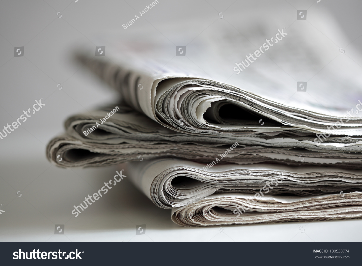 Newspapers folded and stacked concept for global communications #130538774