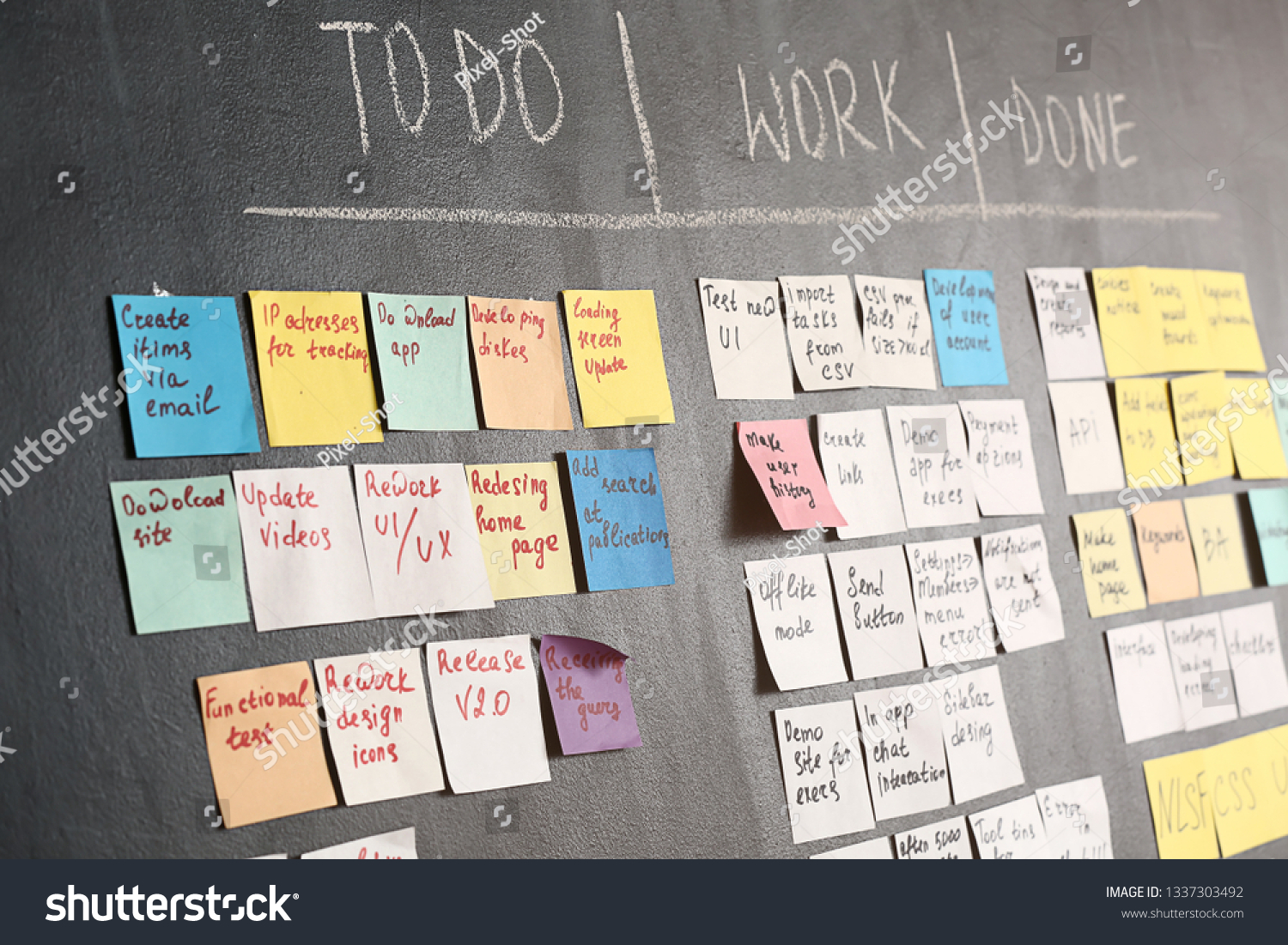 Scrum task board on dark wall in office #1337303492