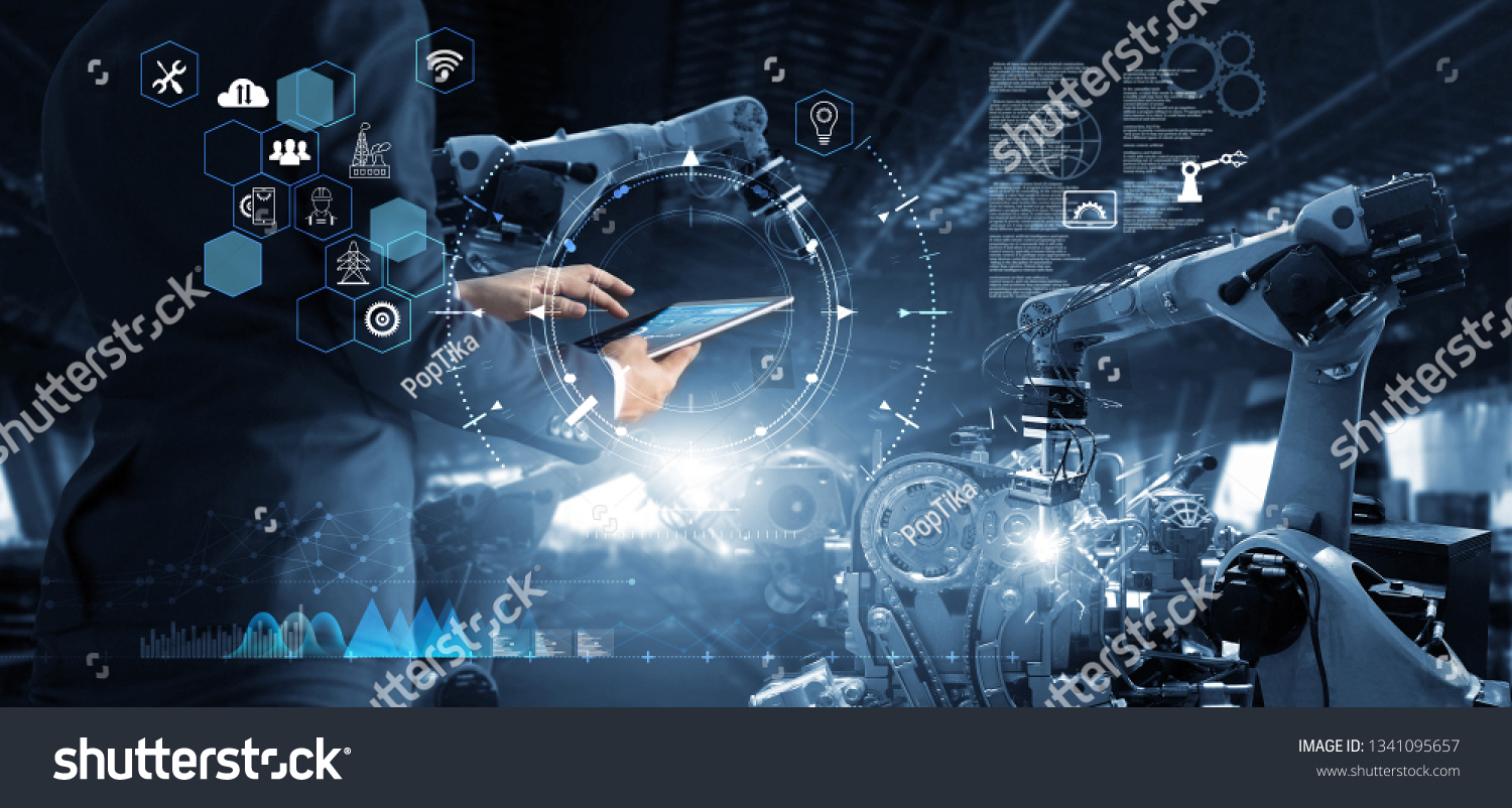 Manager Technical Industrial Engineer working and control robotics with monitoring system software and icon industry network connection on tablet. AI, Artificial Intelligence, Automation robot arm #1341095657