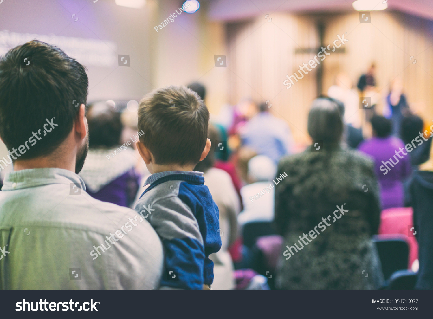 Father with his son participate at christian congregation worship #1354716077