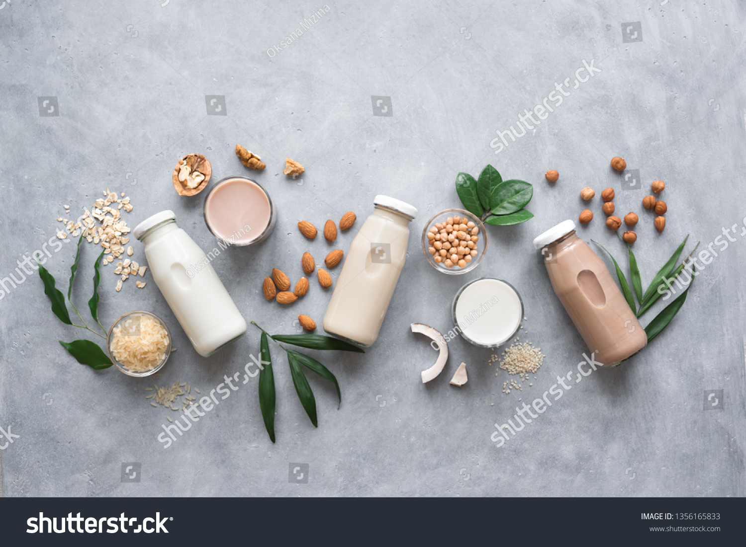 Various vegan plant based milk and ingredients, top view, copy space. Dairy free milk substitute drink, healthy eating. #1356165833