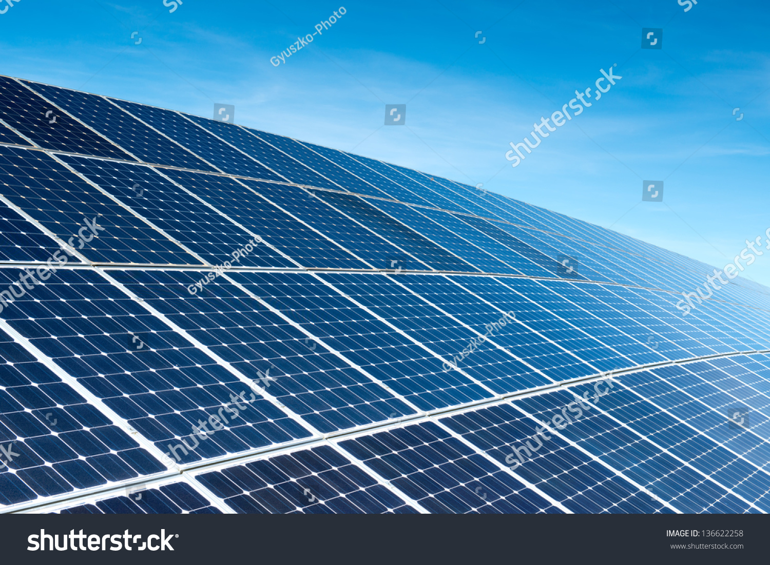 Solar Panels Against The Deep Blue Sky #136622258