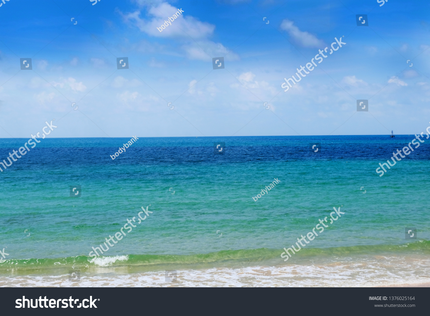 Sea and sky background. Sea view from tropical beach with sunny sky. Summer paradise beach of Thailand. Tropical shore. Tropical sea in Thailand. Exotic summer beach with clouds on horizon. Ocean beac #1376025164