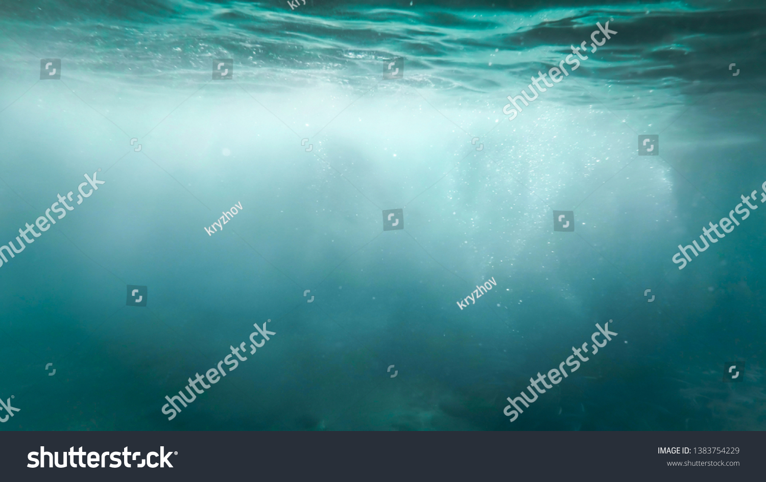 Abstract photo of lots of bubbles floating in clear turqouise sesa water #1383754229