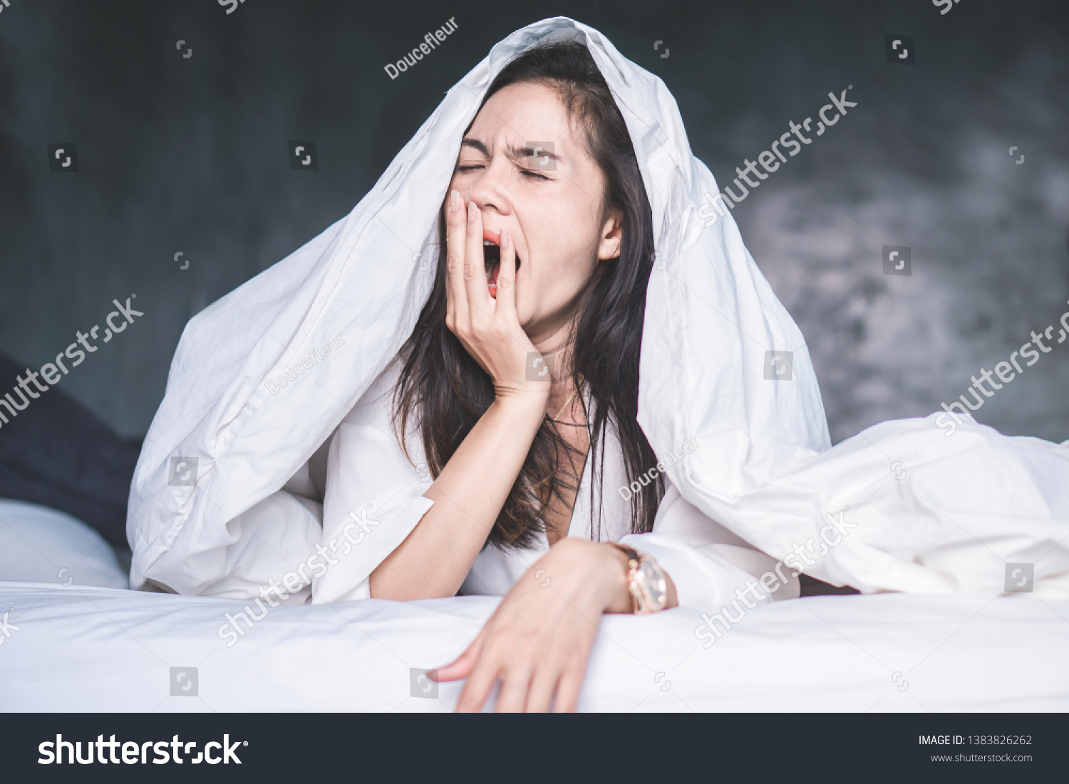sleepless Asian woman wake up on bed and yawning feeling tired  #1383826262