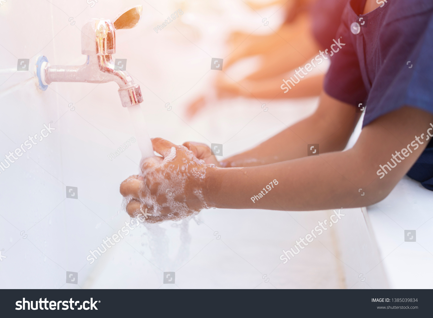 close up hands of children or Pupils At preschool Washing hands with soap under the faucet with water,copy space for text or product you. clean and Hygiene concept. #1385039834