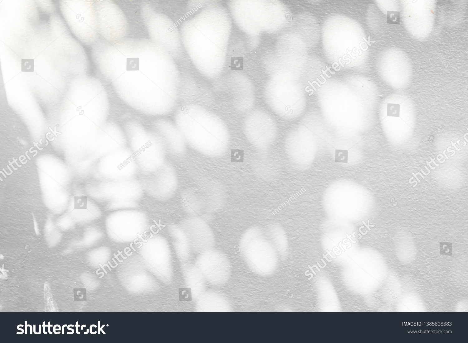 Abstract tree and leaves shadow background with light bokeh,  arts of natural leaves tree branch pattern falling on white wall texture for background and wallpaper, black and white monochrome tone #1385808383