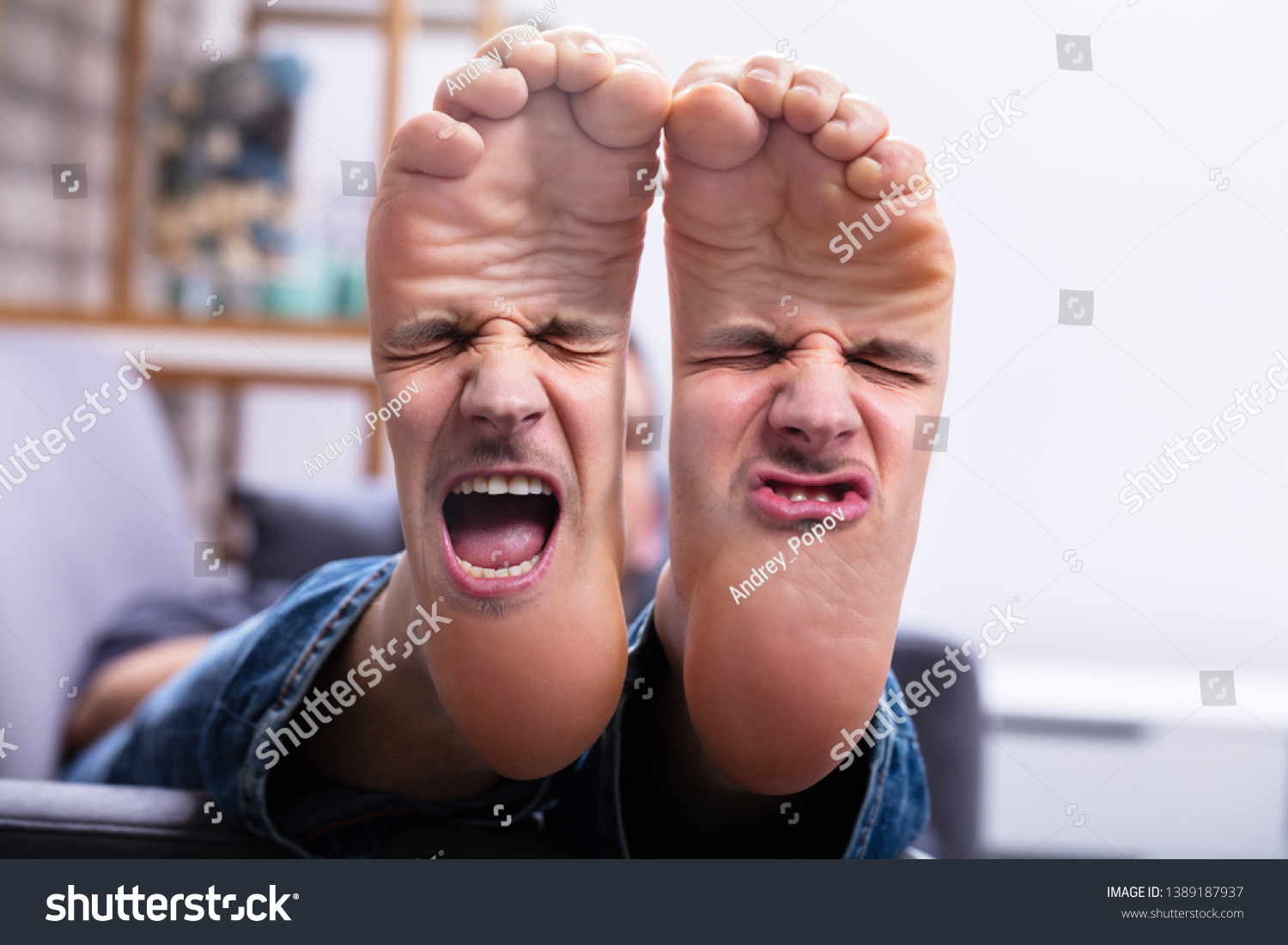 Close-up Of Man's Feet With Painful Facial Expression #1389187937