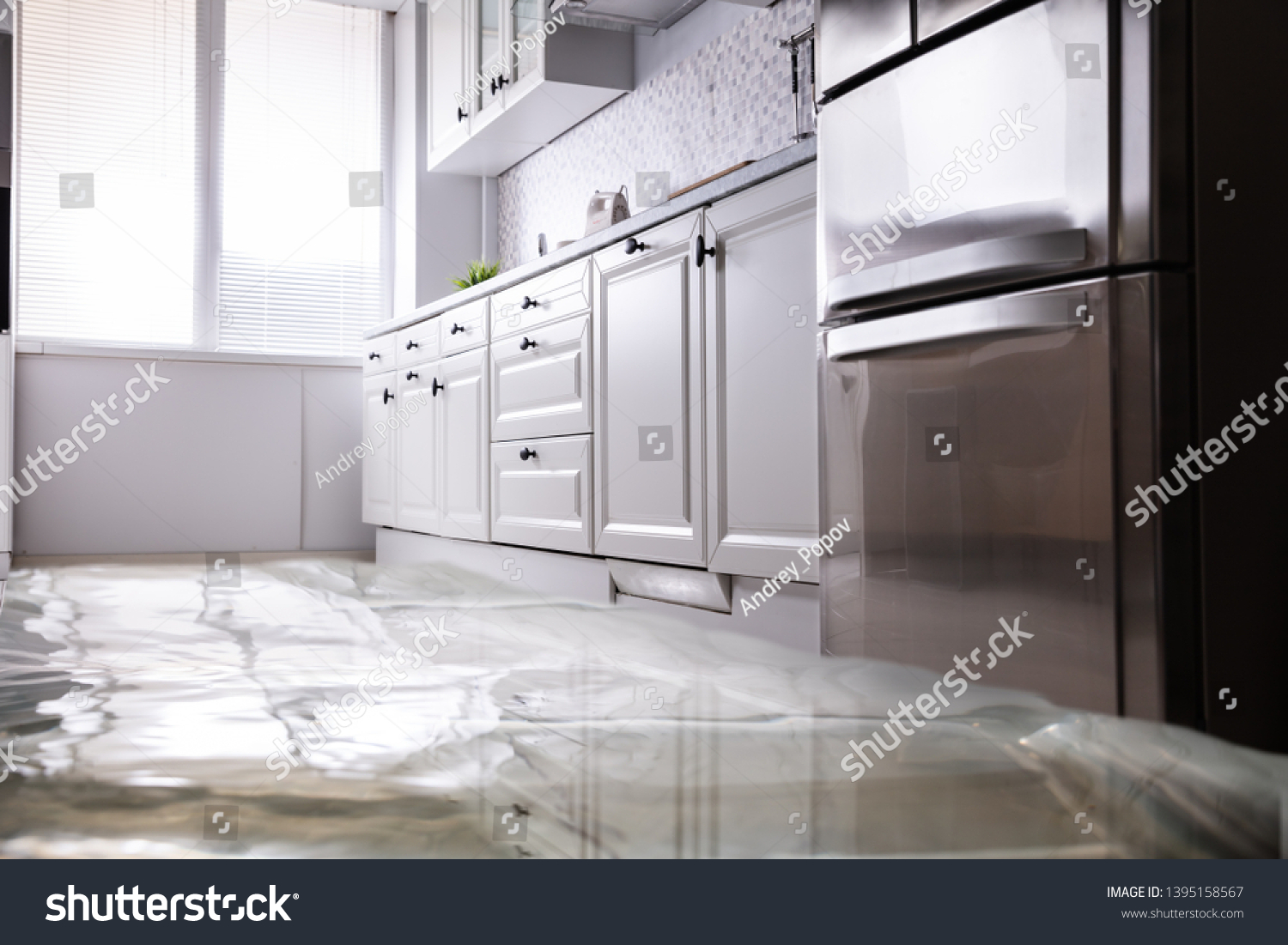 Close-up Of Flooded Floor In Kitchen From Water Leak #1395158567