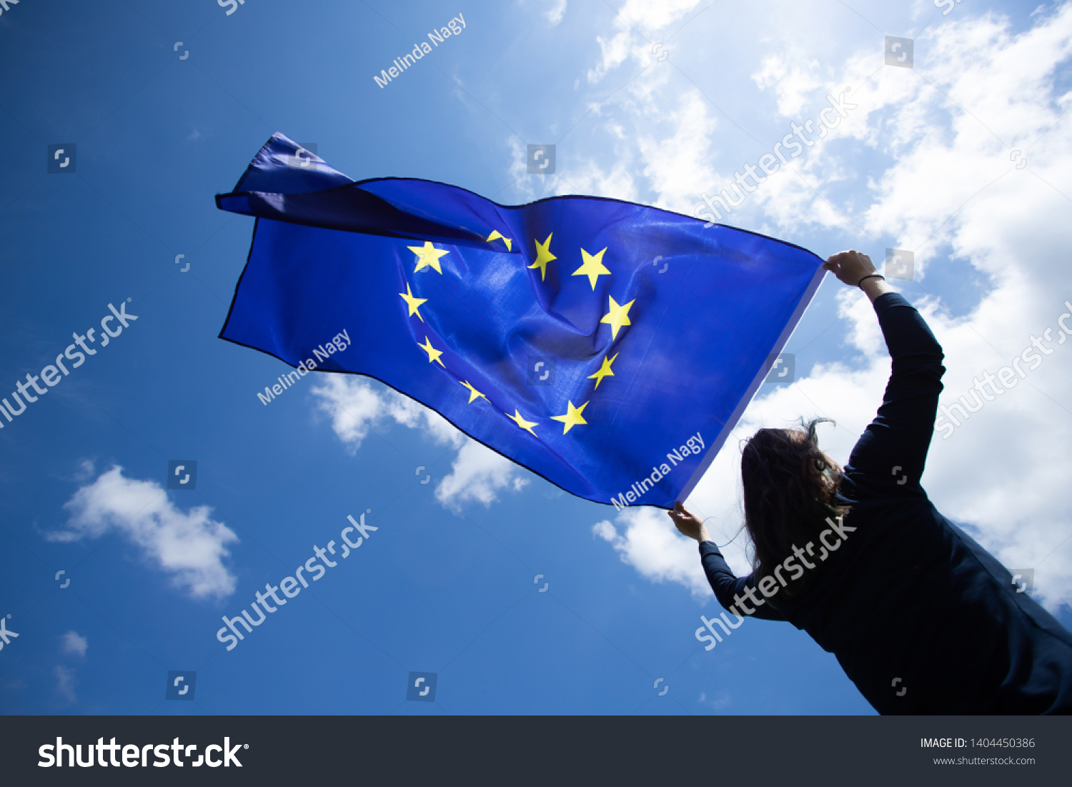 Young woman holding European Union flag. Voting, election concept. #1404450386