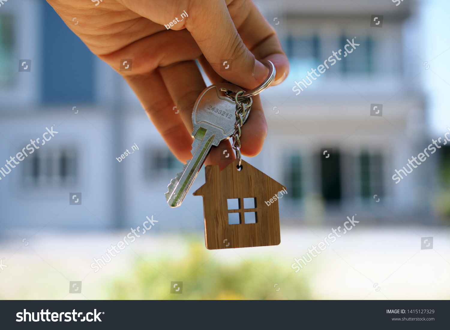 Landlord unlocks the house key for new home #1415127329