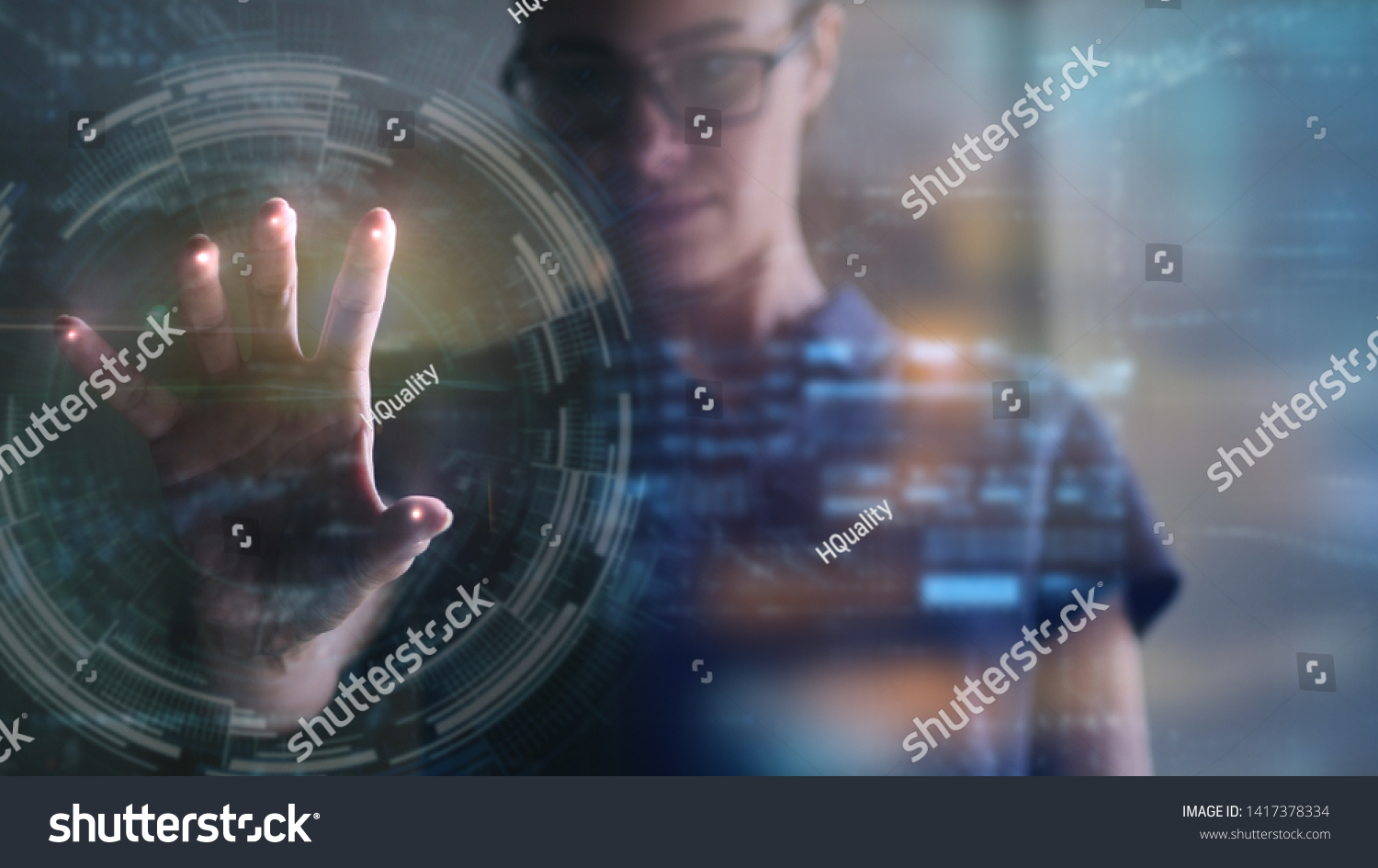 Portrait of an young woman is using the futuristic latest innovation technology with augmented reality hologram. Concept of future, innovation, technology, holographic #1417378334