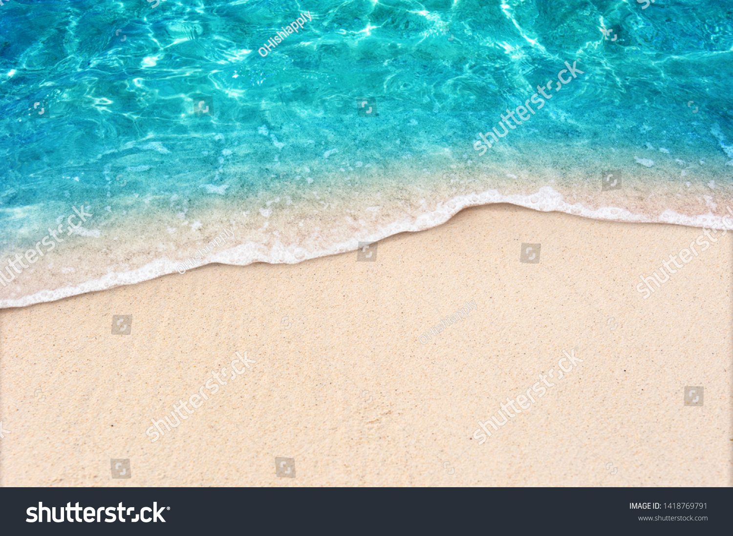 Soft blue ocean wave on clean sandy beach #1418769791