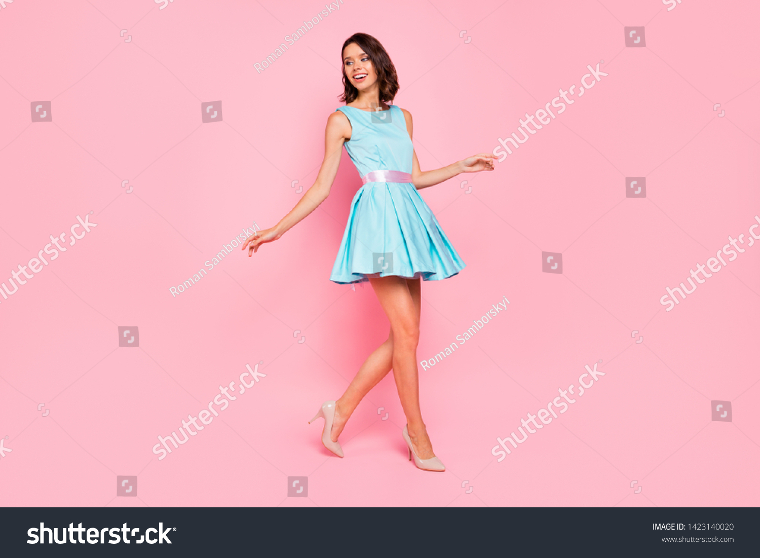 Full length side profile body size photo beautiful she her lady going graduation college university school walking street wear high-heels colorful blue dress isolated pink bright vivid background #1423140020