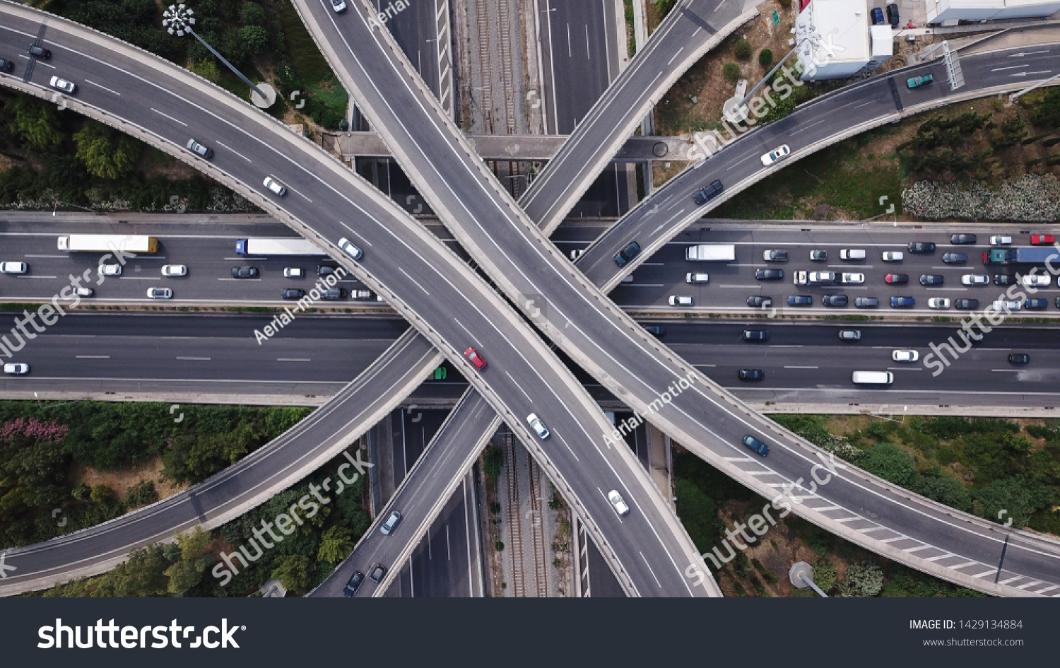Aerial drone top view photo of highway multilevel junction interchange road in urban populated area #1429134884