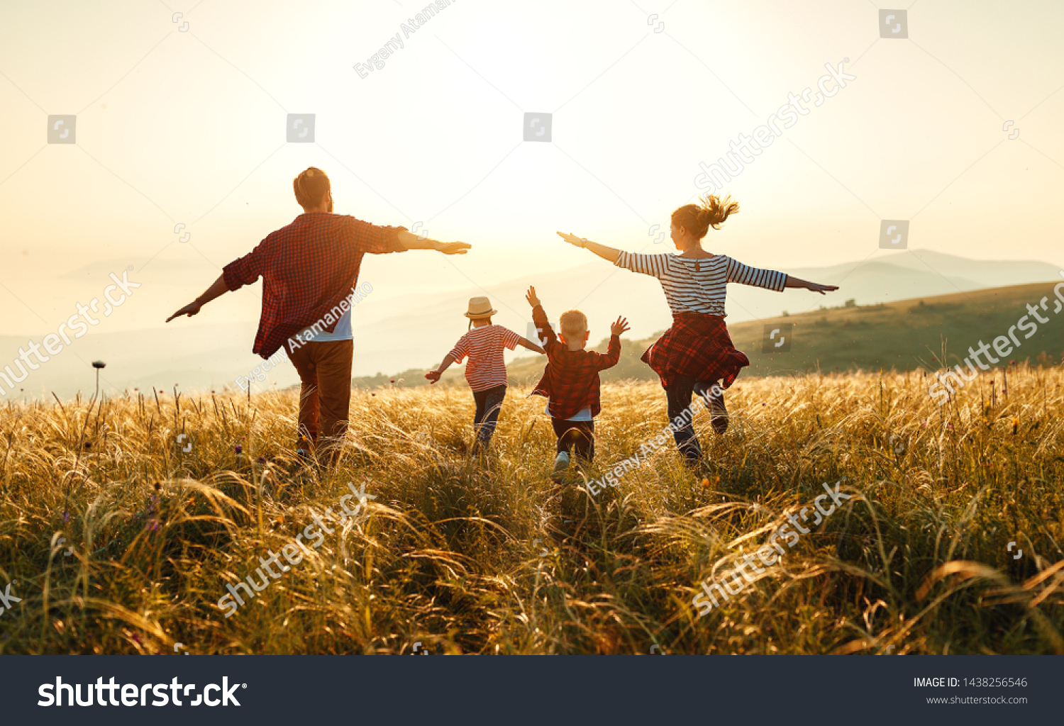 Happy family: mother, father, children son and  daughter on nature  on sunset #1438256546