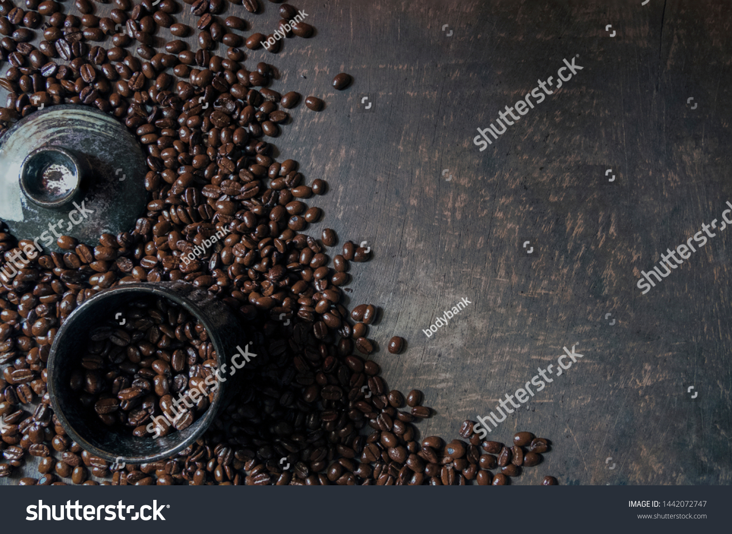 
Coffee cup and coffee beans on the wooden floor. Top view with copy space for your text #1442072747