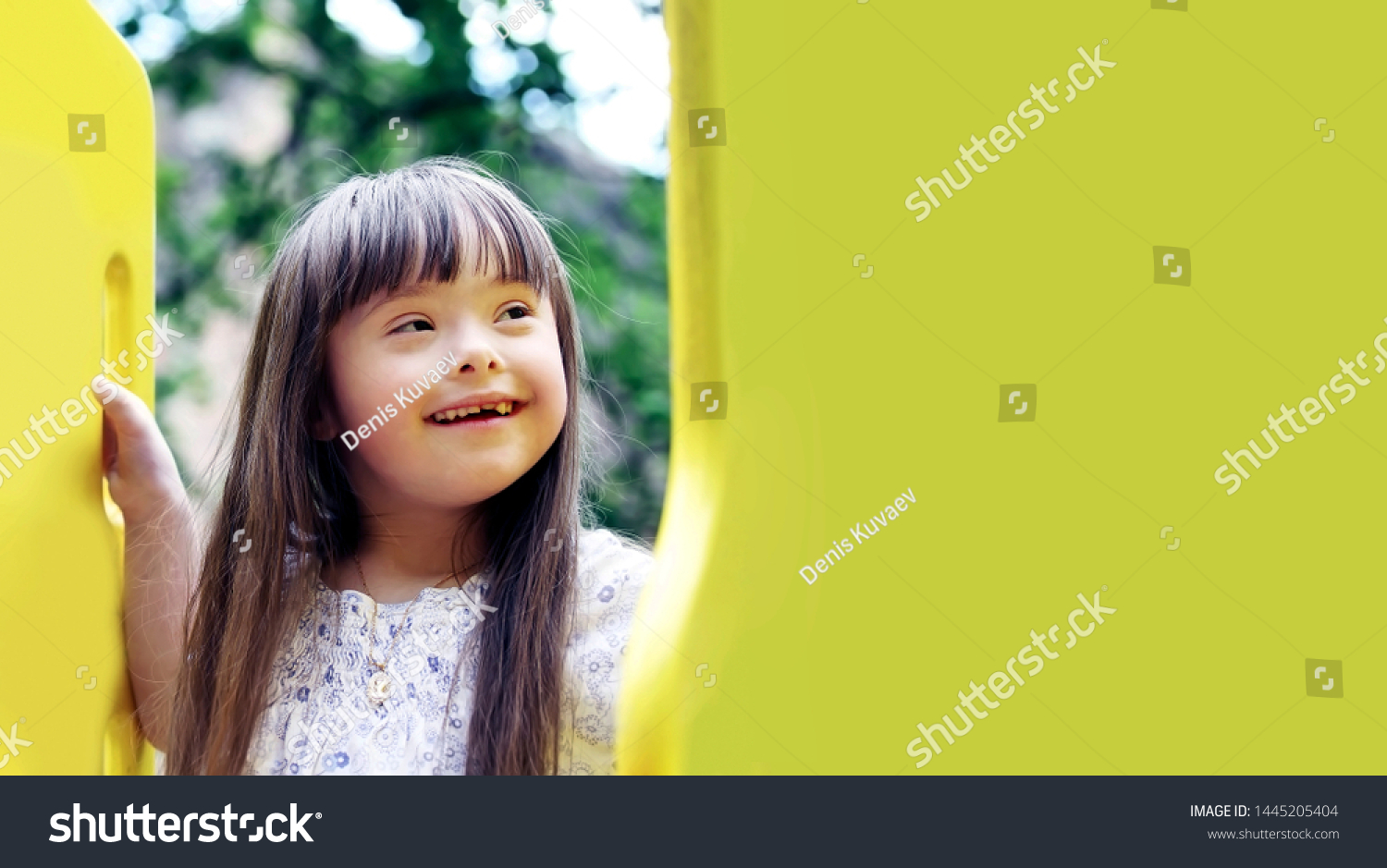 Portrait of beautiful young girl on the playground. #1445205404