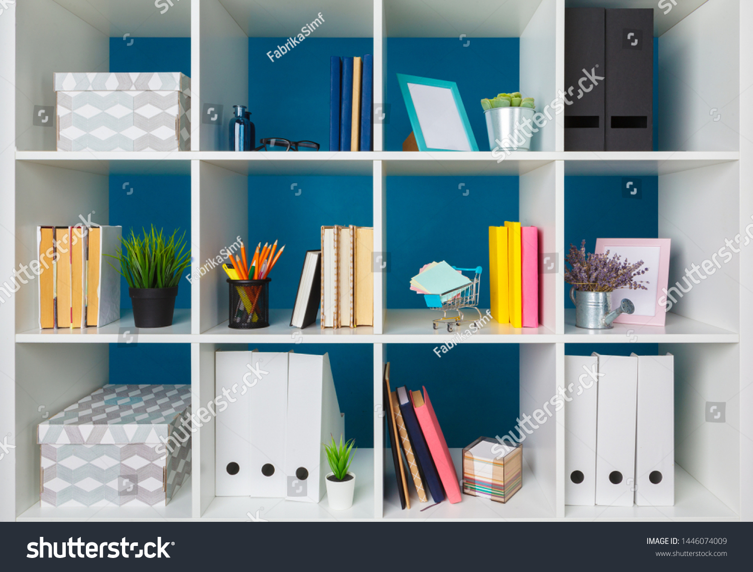 Stacks of supplies and paperwork in the office and bookshelves #1446074009
