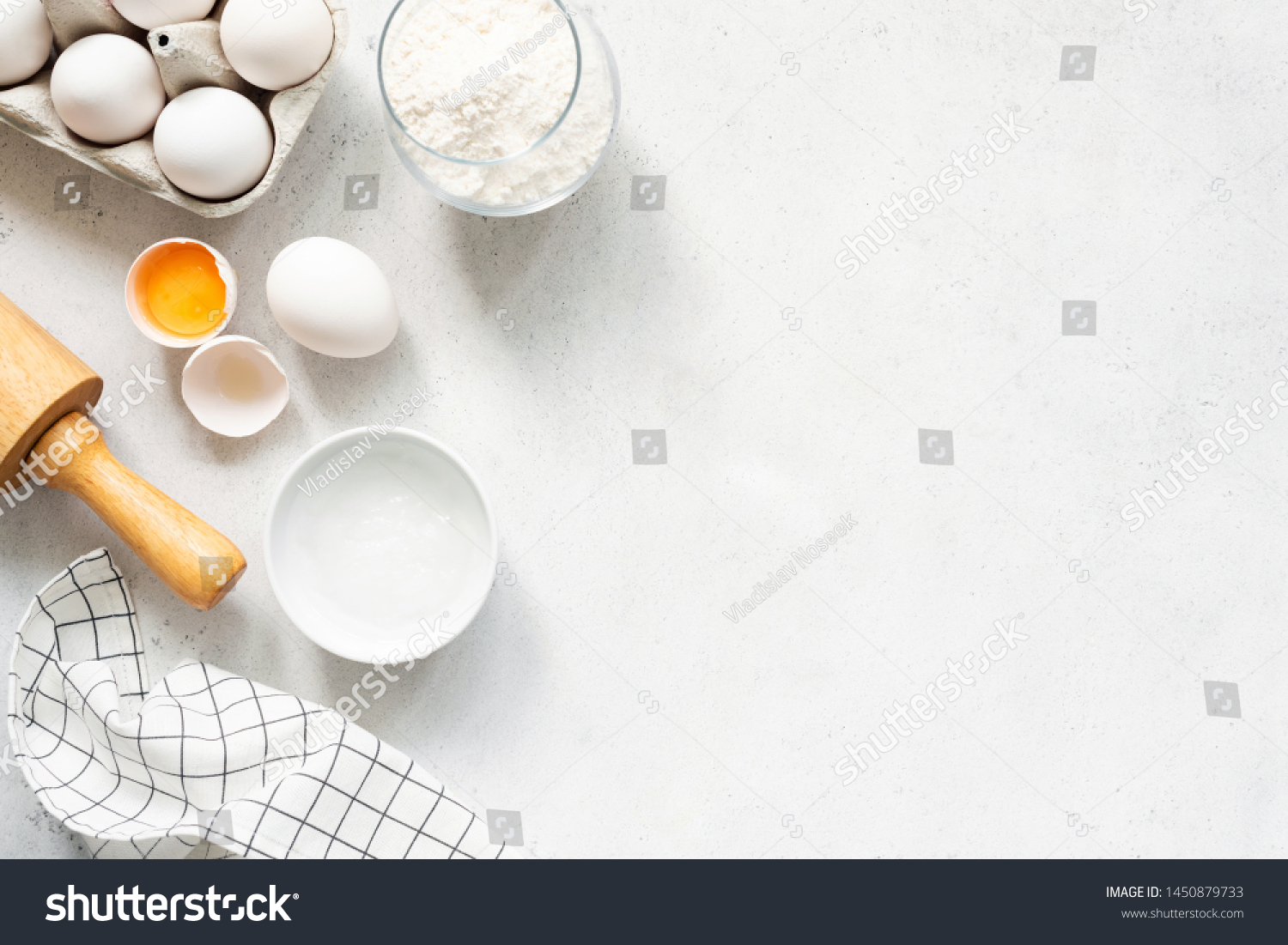 Baking Cooking Ingredients Flour Eggs Rolling Pin Butter And Kitchen Textile On Bright Grey Concrete Background. Top View Copy Space. Cookies Pie Or Cake Recipe Mockup #1450879733