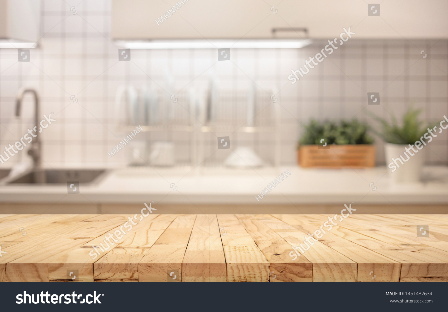 Wood table top on blur kitchen counter (room)background.For montage product display or design key visual layout. #1451482634