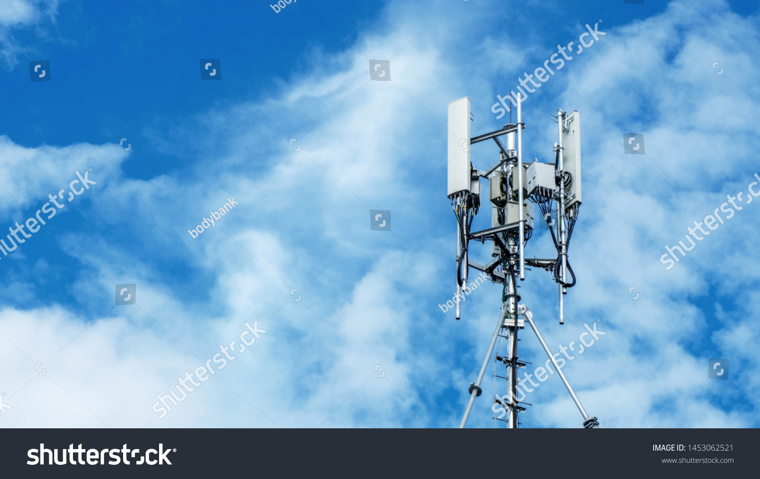 Technology on the top of the telecommunication. Cellular phone antennas on a building roof.Telecommunication mast television antennas.Receiving and transmitting stations. #1453062521