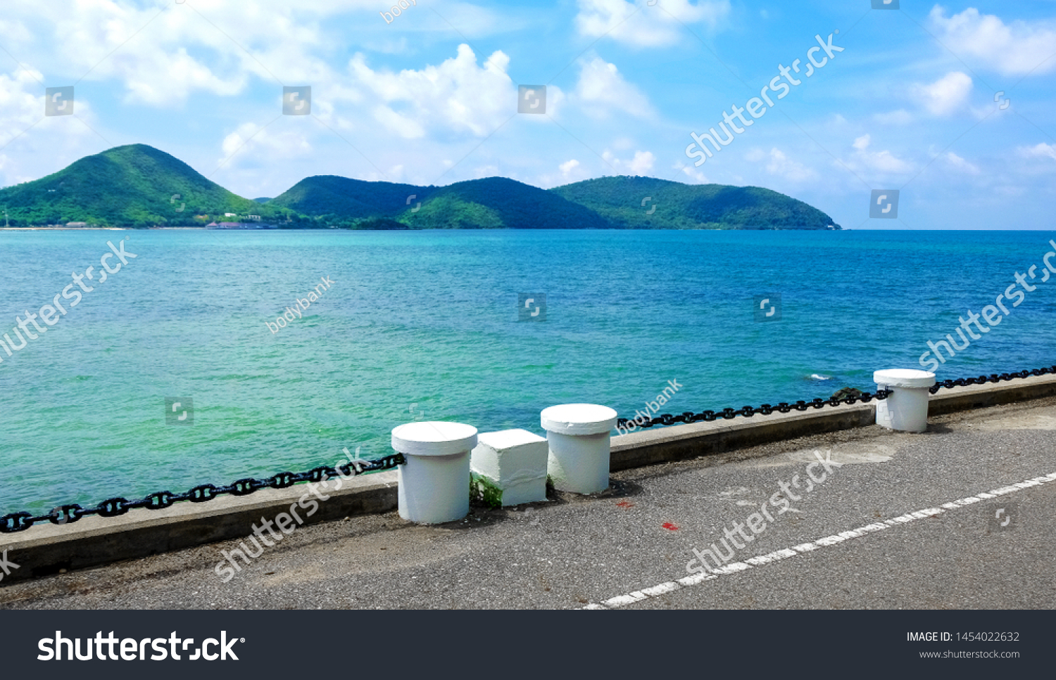 Sea blurred background. Sea view from tropical beach with sunny sky. Summer paradise beach of Thailand. Tropical shore. Tropical sea in Thailand. Exotic summer beach with clouds on horizon. Ocean beac #1454022632