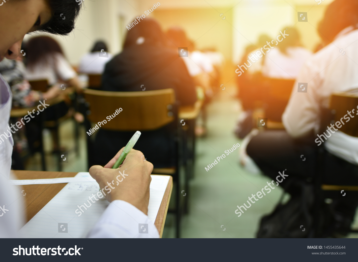 Students taking admission test in exam room at high school, college, or university, education or academic concept picture of professional or vocational learners in training session, selective focus #1455435644