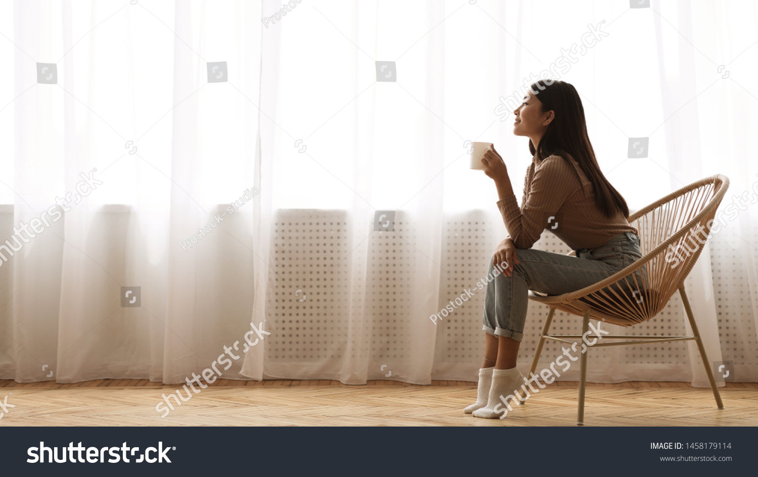 Morning Relaxation. Girl Sitting in Armchair And Enjoying Coffee against Window, Free Space #1458179114