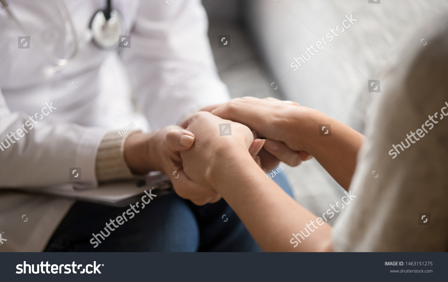 Close up horizontal image doctor in white uniform holding hands of female patient, showing support, gave professional aid psychological help, disease express of empathy and trusted specialist concept #1463151275