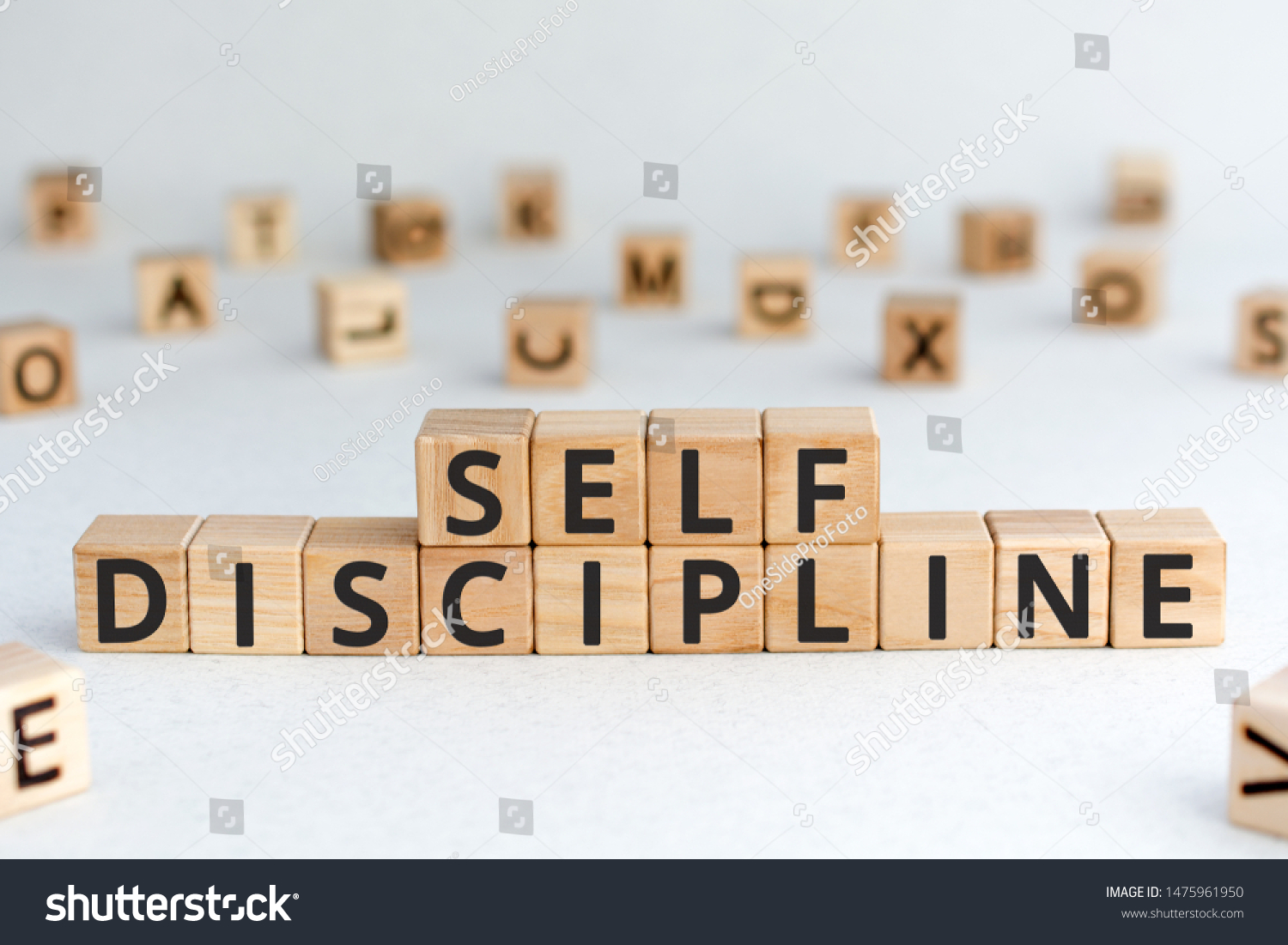 Self discipline - words from wooden blocks with letters, self-discipline concept, random letters around, white  background #1475961950