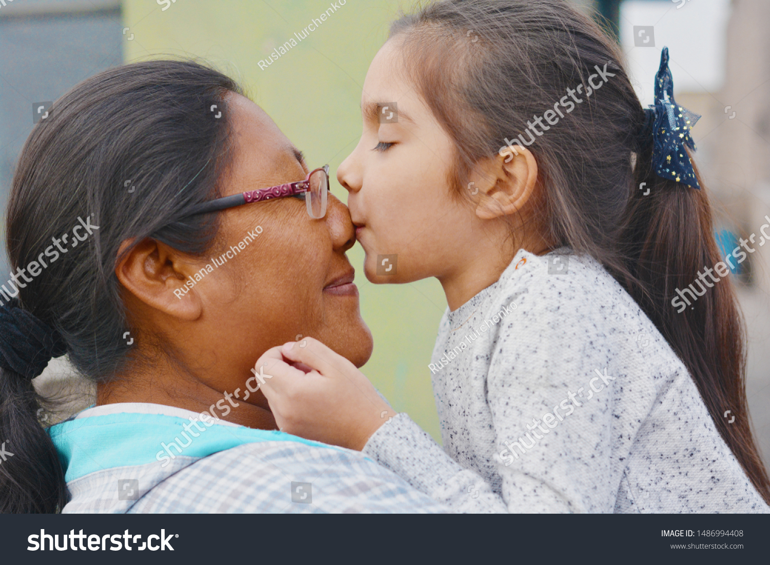 Tender portrait of native american woman with her little daughter. #1486994408