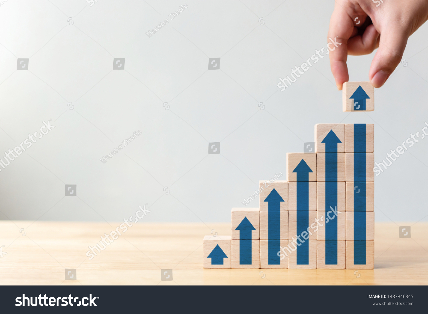 Ladder career path for business growth success process concept.Hand arranging wood block stacking as step stair with arrow up #1487846345
