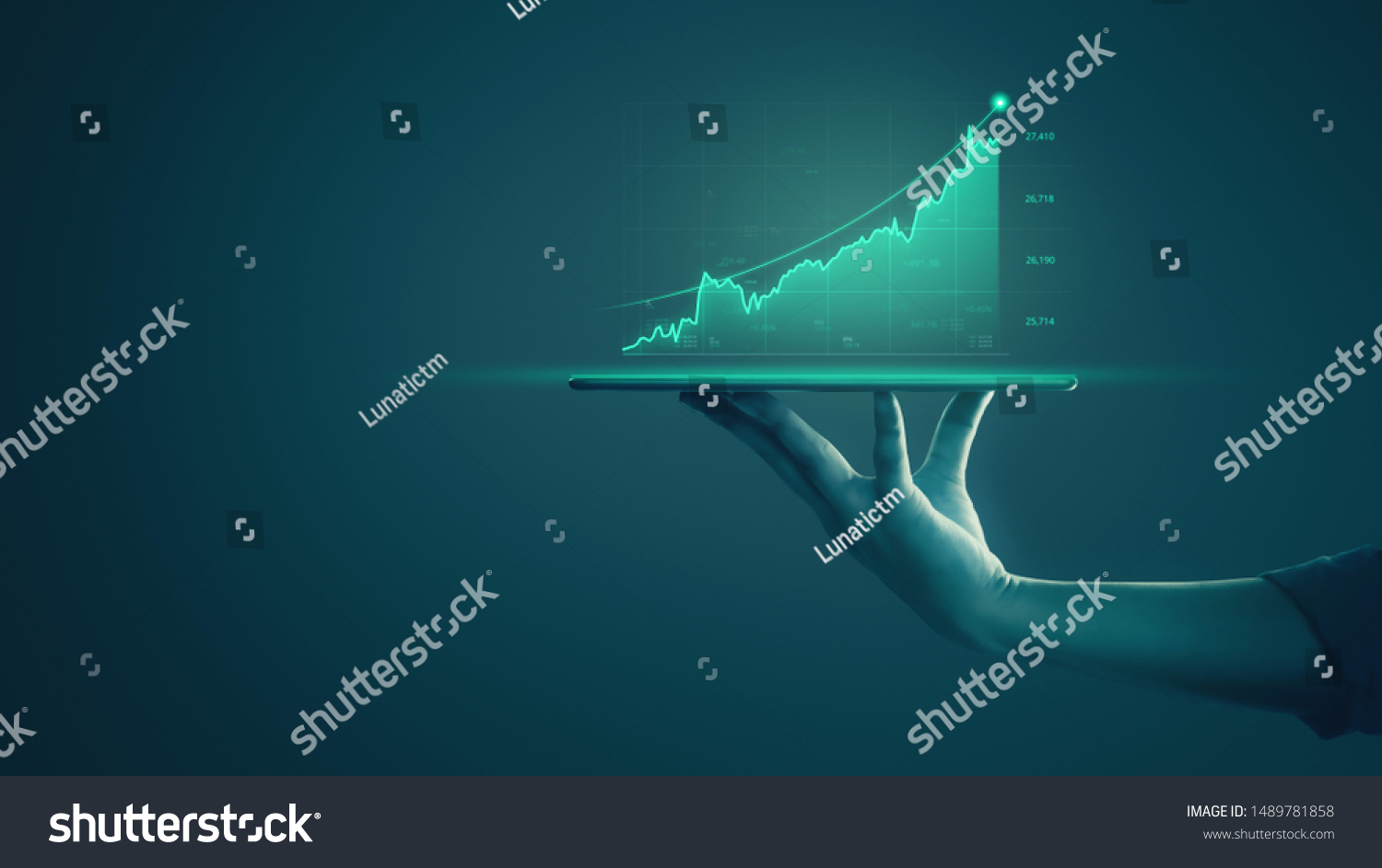 Business man holding tablet and showing holographic graphs and stock market statistics gain profits. Concept of growth planning and business strategy. Display of good economy form digital screen. #1489781858